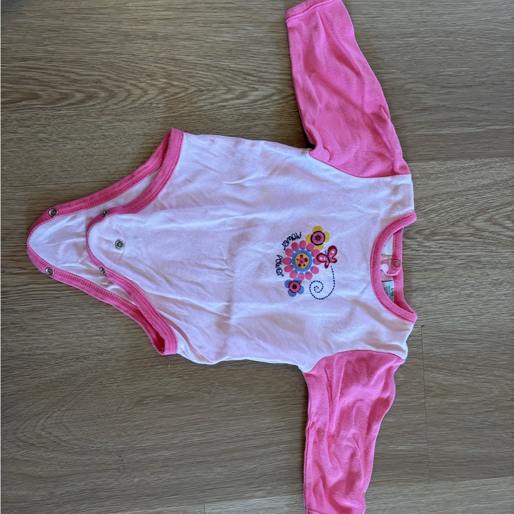 Baby pink onesie with floral design